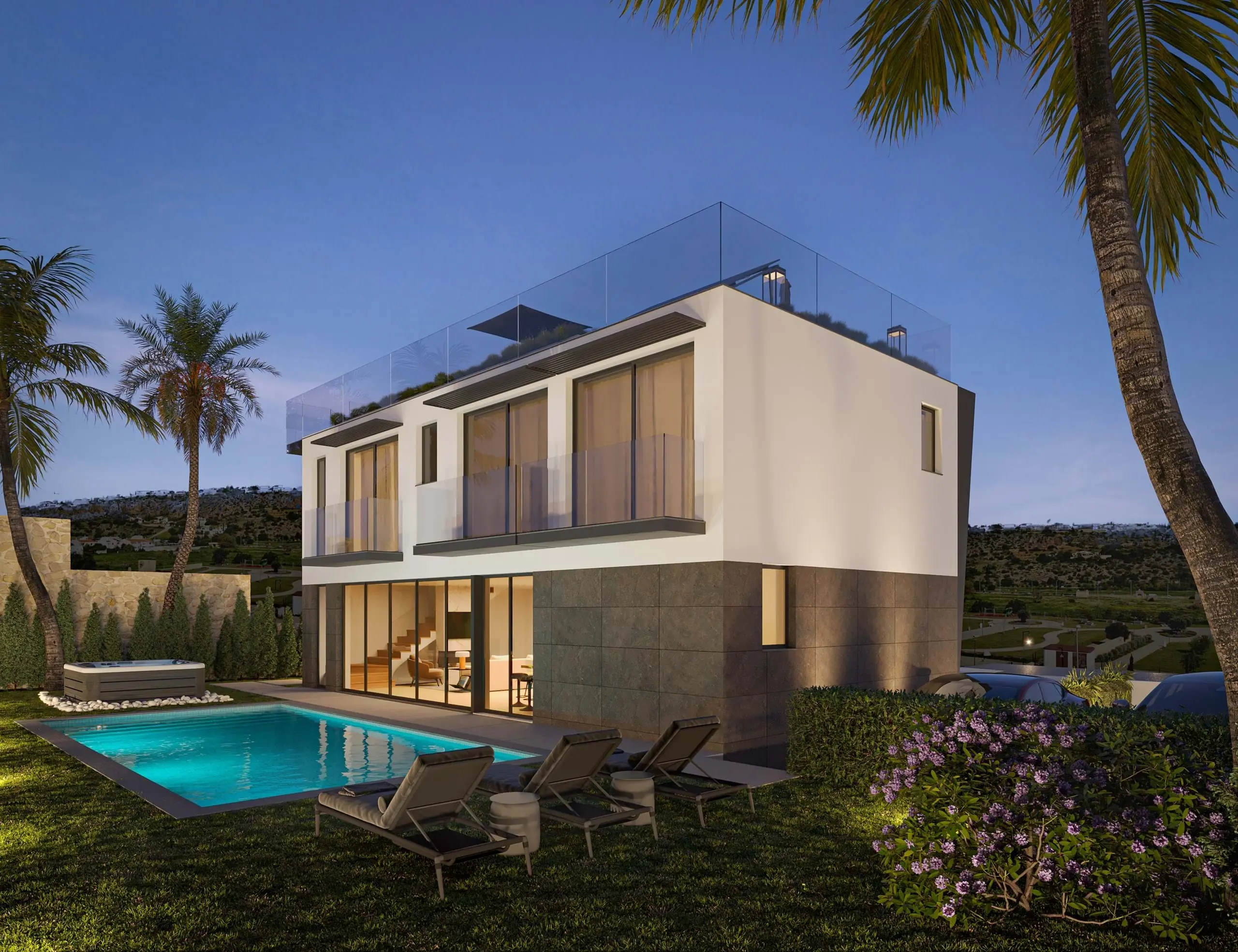 Modern two-storey villa with pool at dusk