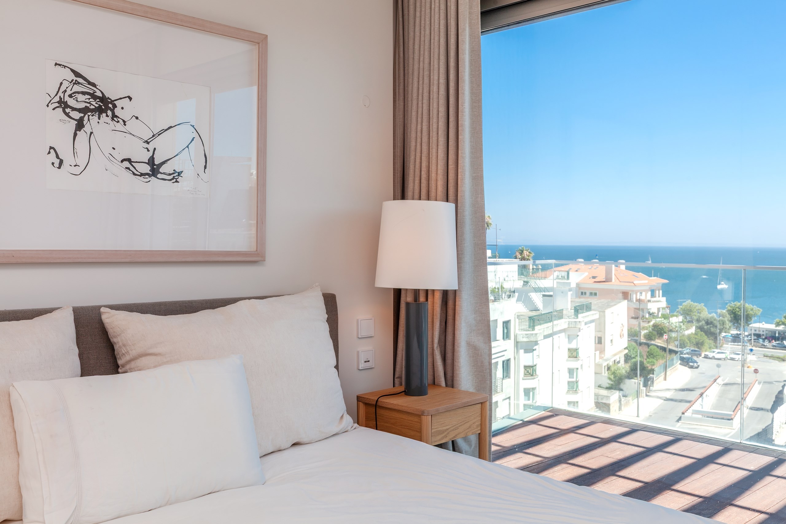 Modern bedroom with sea view balcony