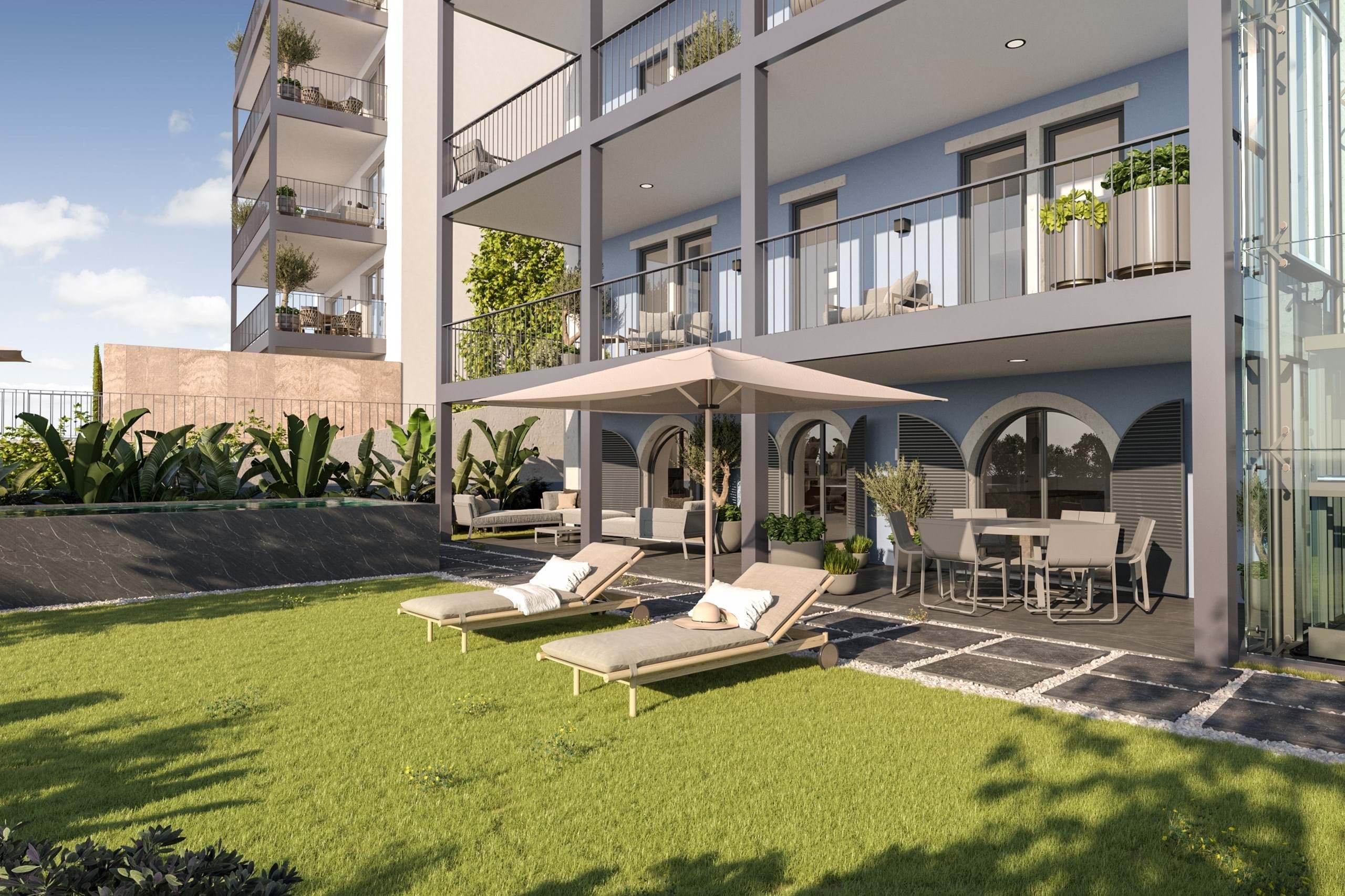 Modern apartment garden with loungers and patio