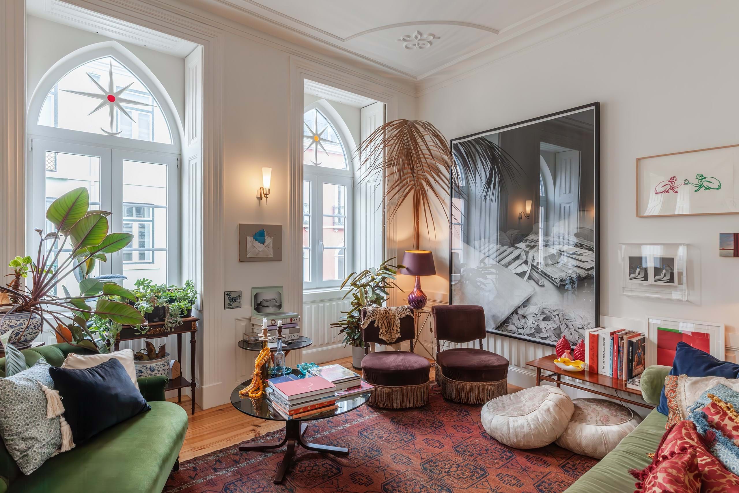 Elegant living room with arched windows and artwork