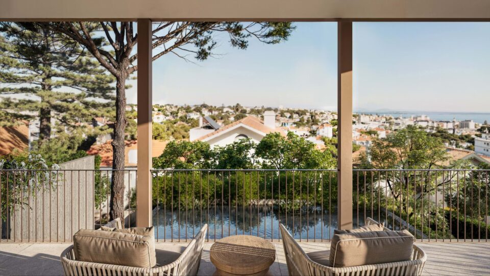 Balcony overlooking coastal town and sea