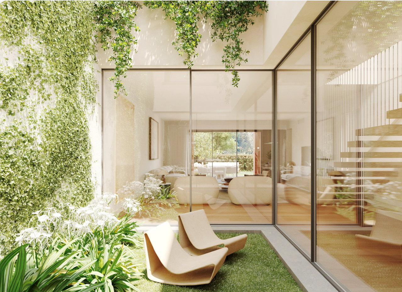 Modern courtyard with glass walls and lounge chairs