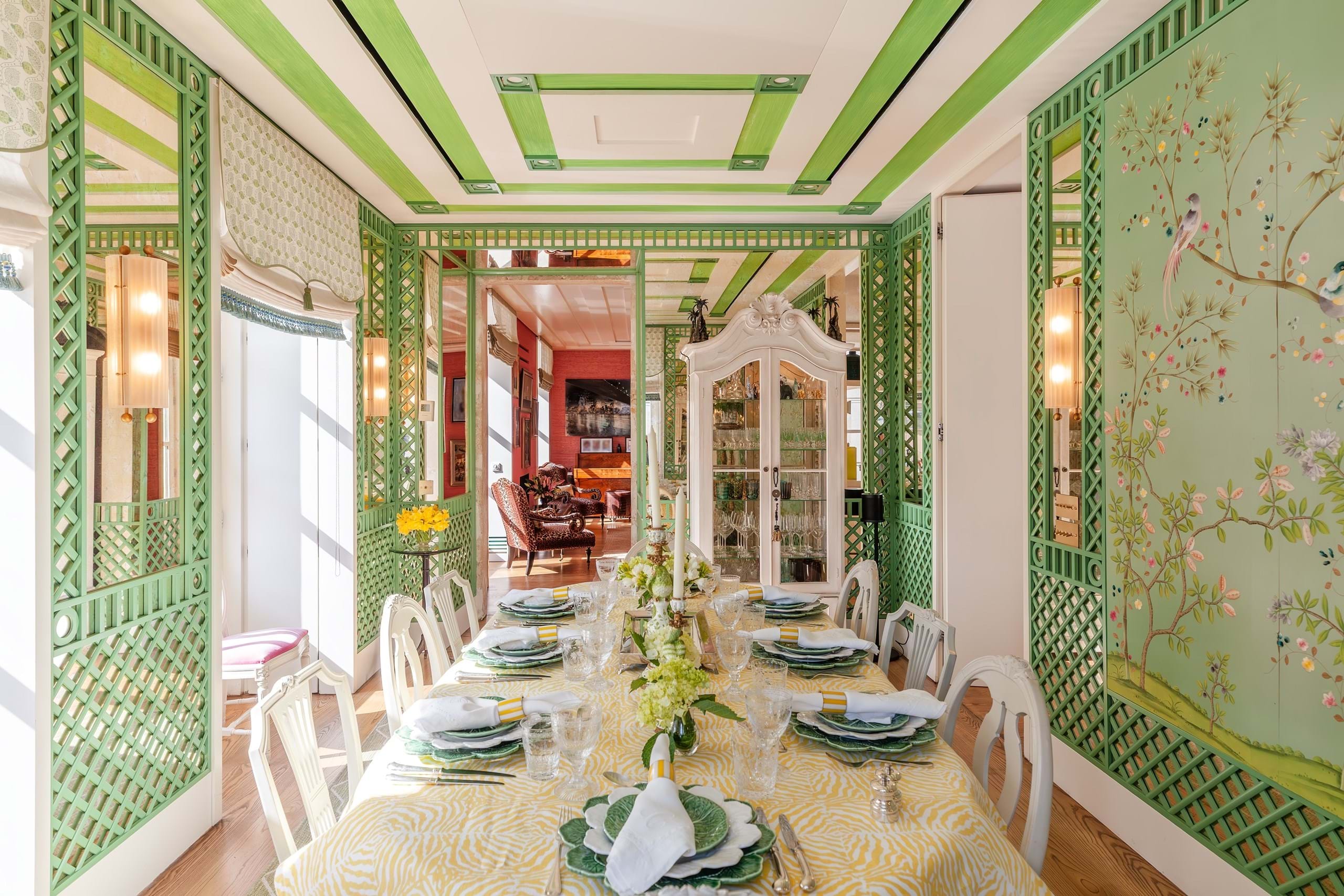 Elegant green lattice dining room with set table