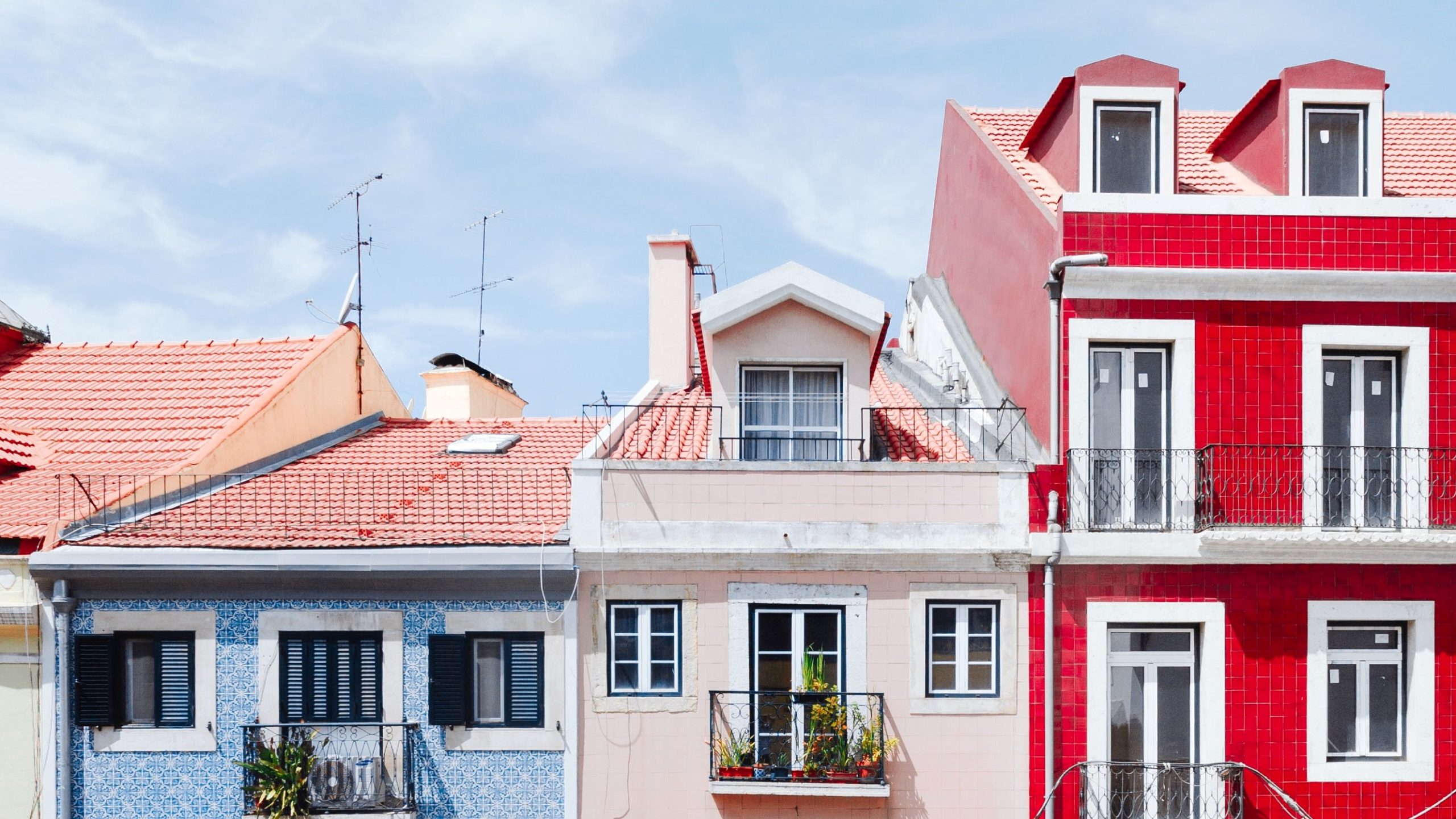 Colourful tiled houses with balconies and shutters