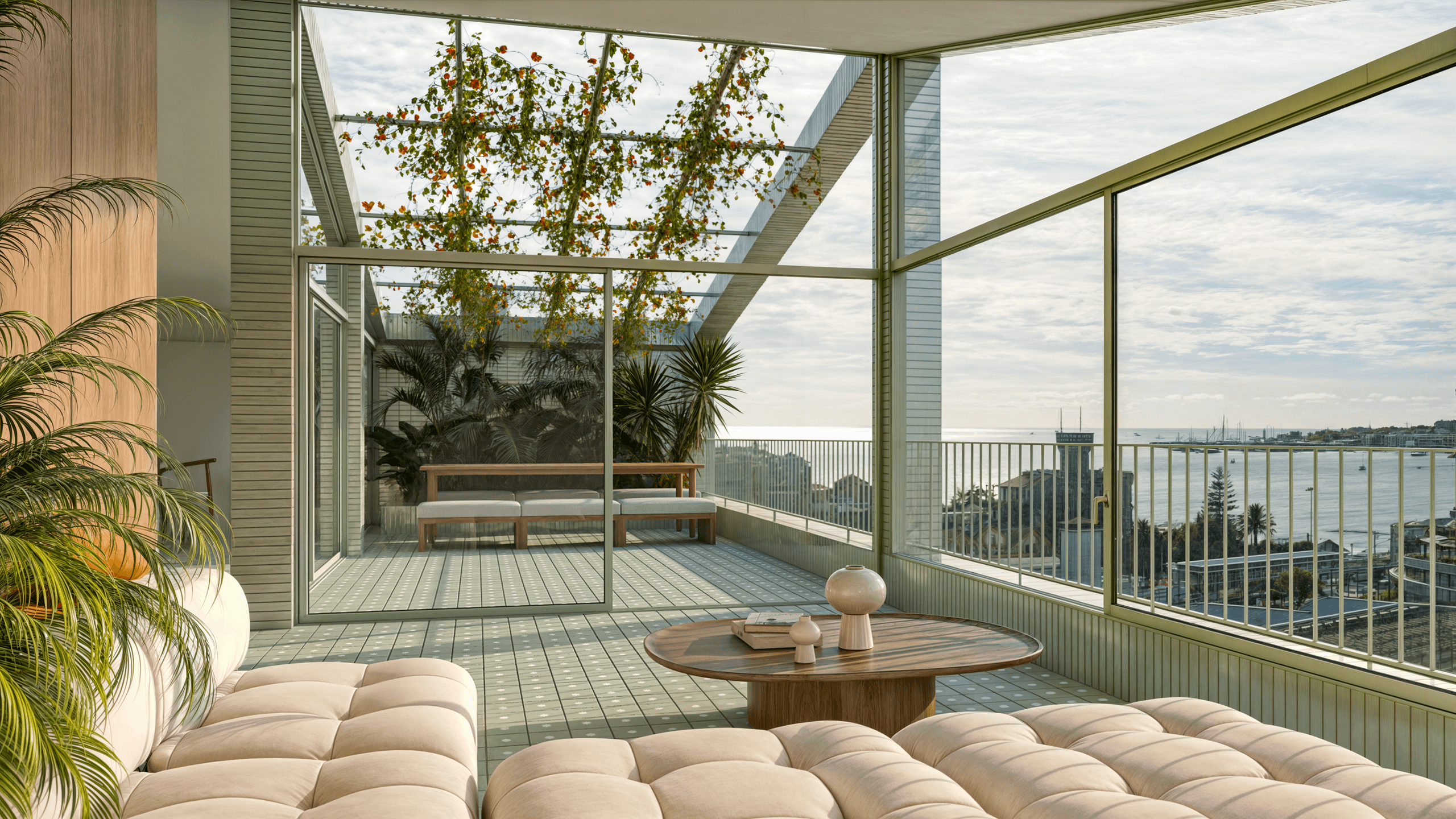 Modern glass balcony lounge overlooking seaside city