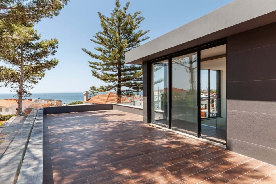 Modern terrace with sea view and glass railing