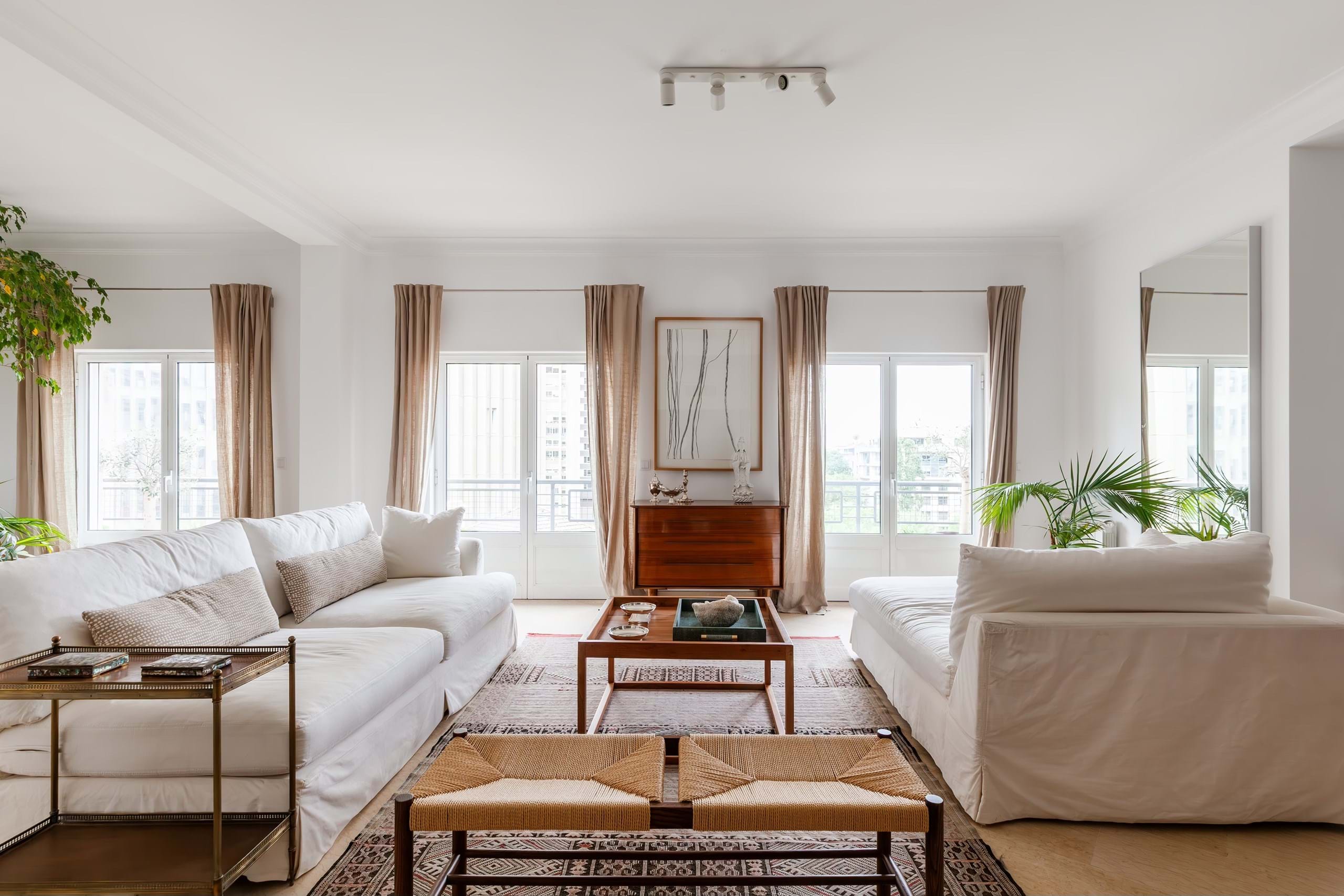 Bright modern living room with white sofas