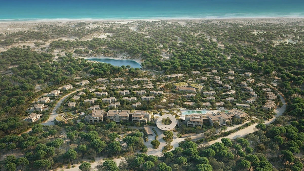 Aerial view of circular forest resort by sea