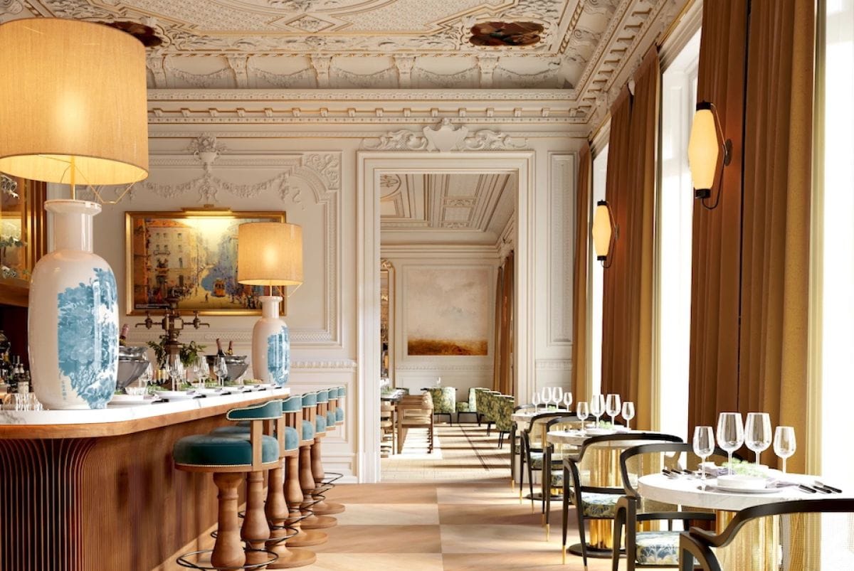 Elegant restaurant interior with ornate ceiling and bar