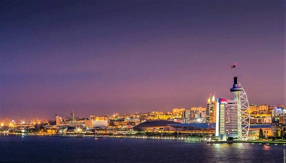 Lisbon waterfront skyline with Vasco da Gama Tower at dusk